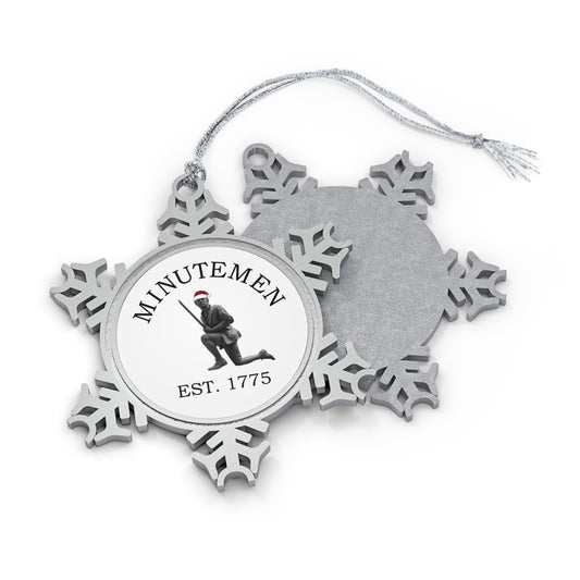 Minuteman pewter snowflake ornament, front and back — kneeling minute man statue with Santa hat medallion, Est. 1775, silver cord